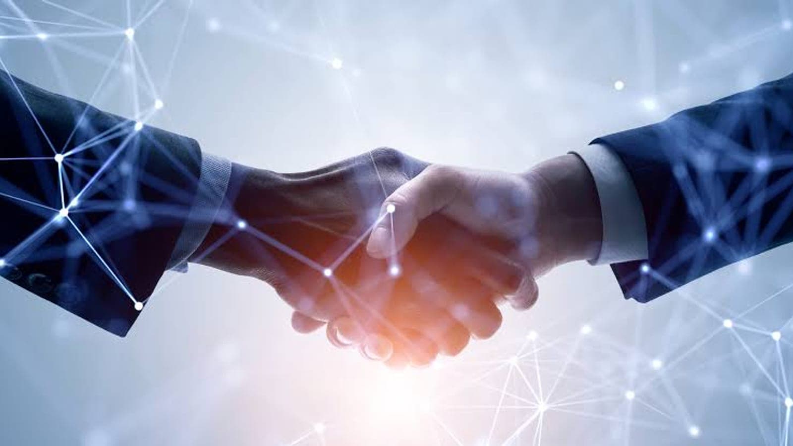Handshake with digital connections, representing an outsourced IT partnership