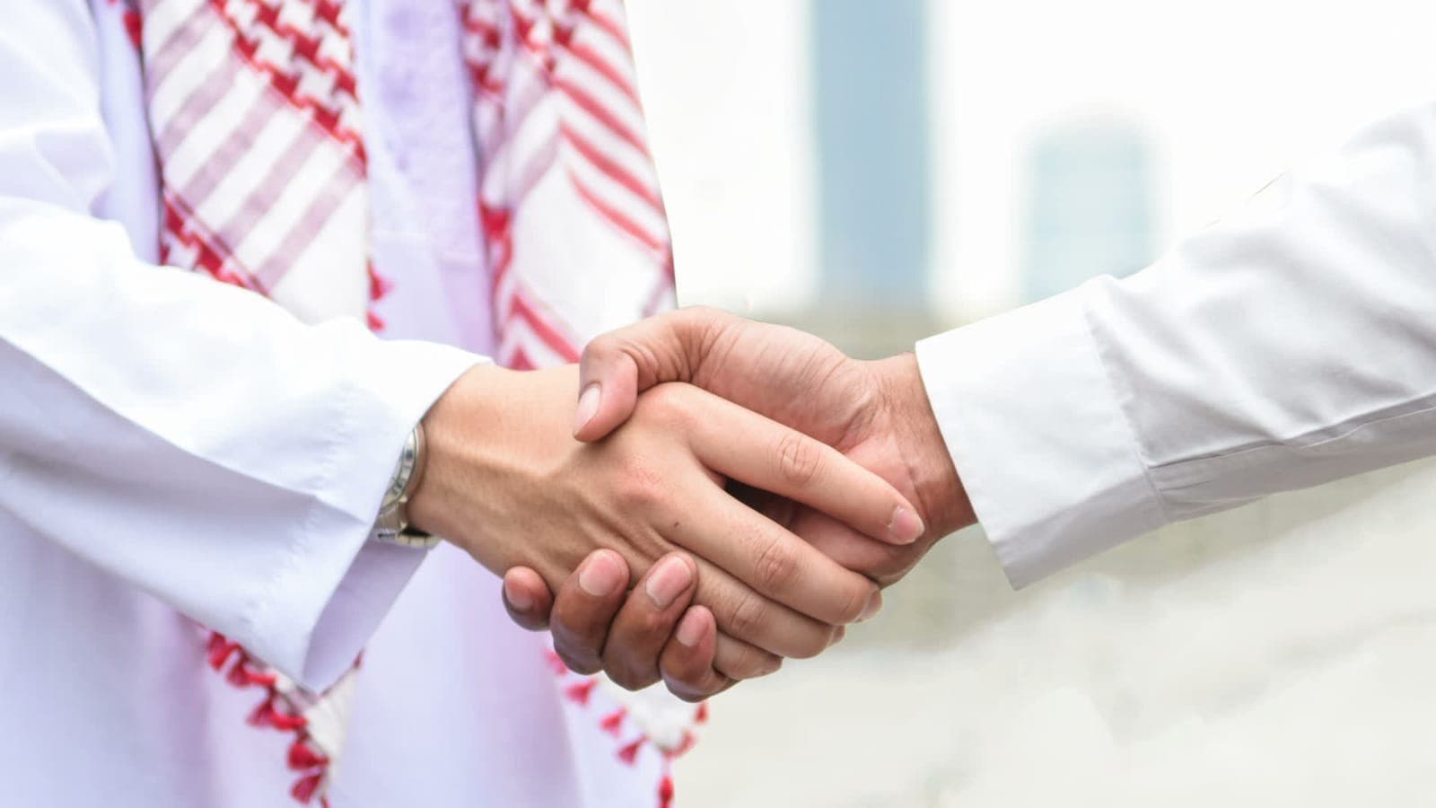 Two businessmen shaking hands, agreeing an IT support partnership