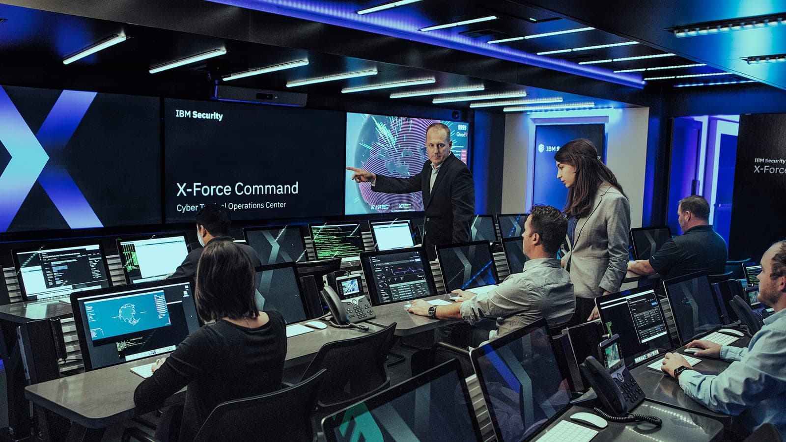 Specialist engineers monitoring infrastructure in an operations centre