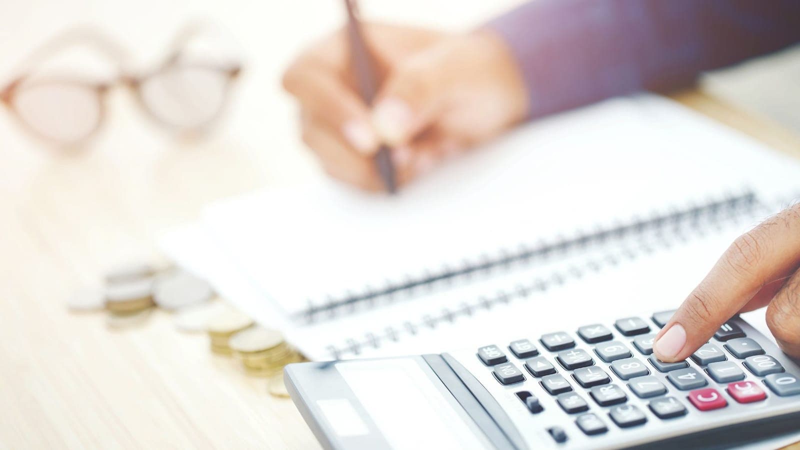 Business owner reviewing IT budget and finances at a desk