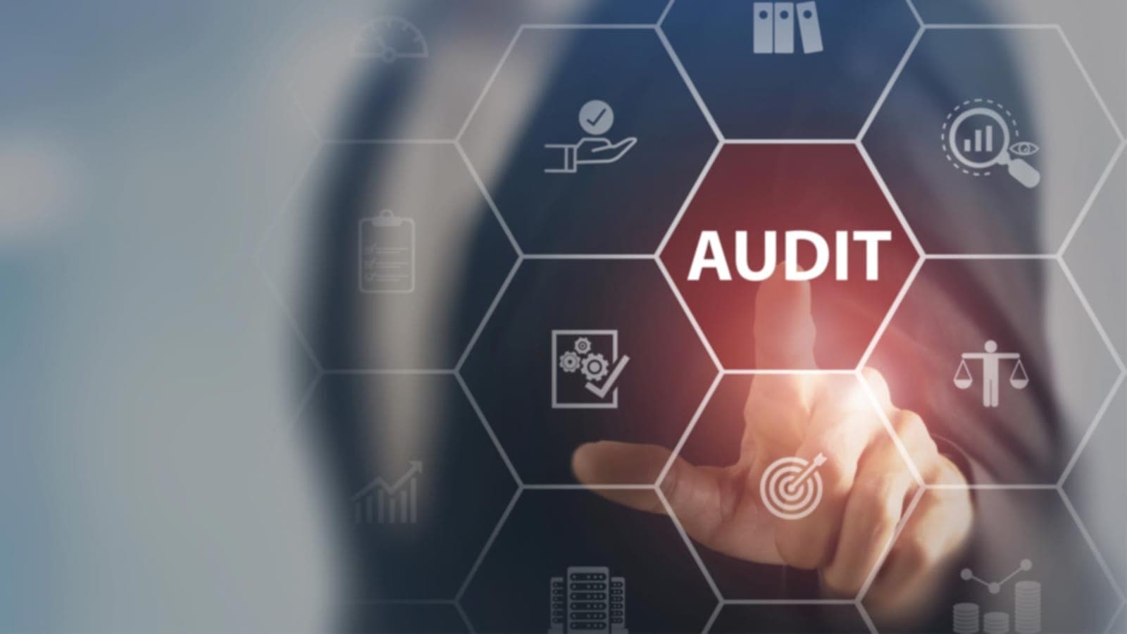 Analyst pointing at an audit dashboard to find IT cost savings