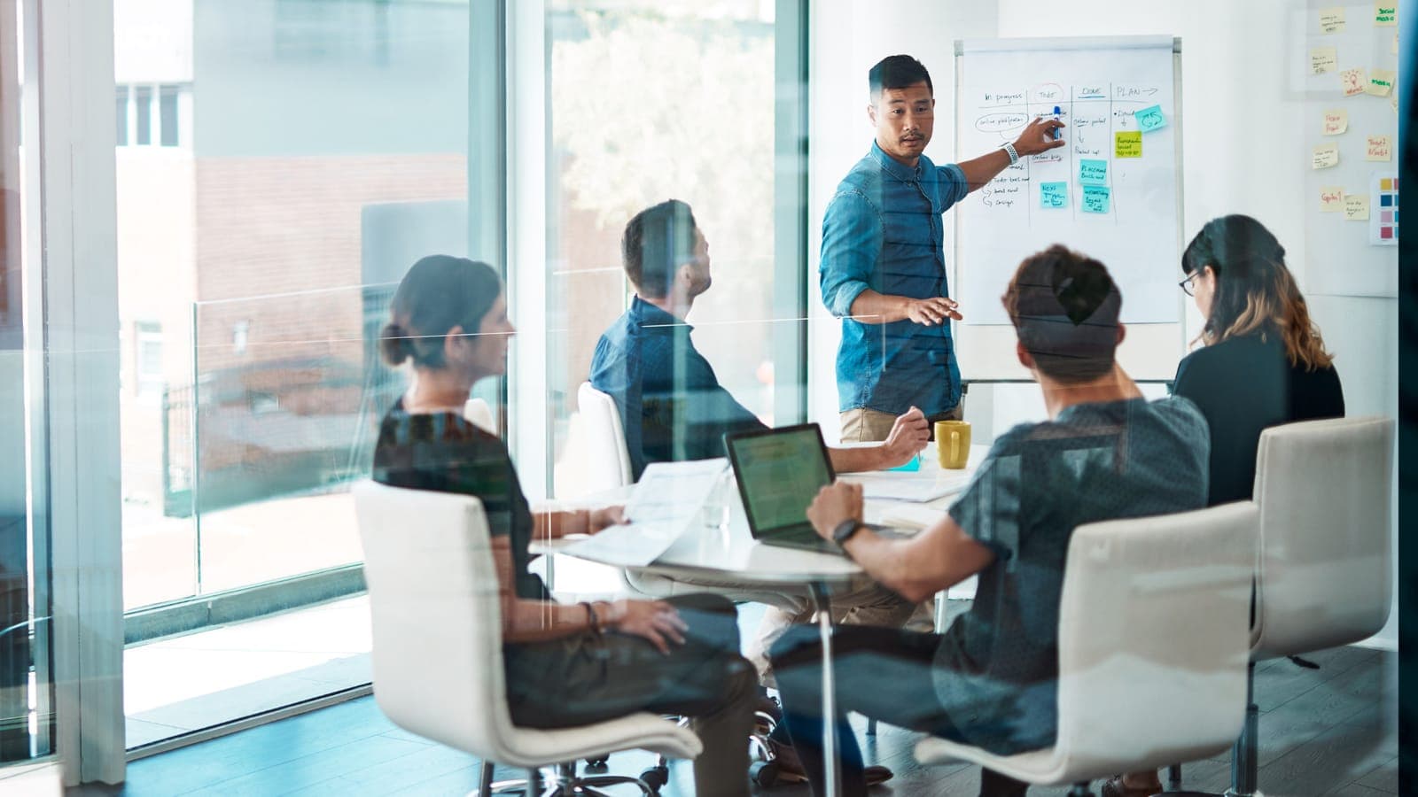 Team discussing options together in a modern office meeting