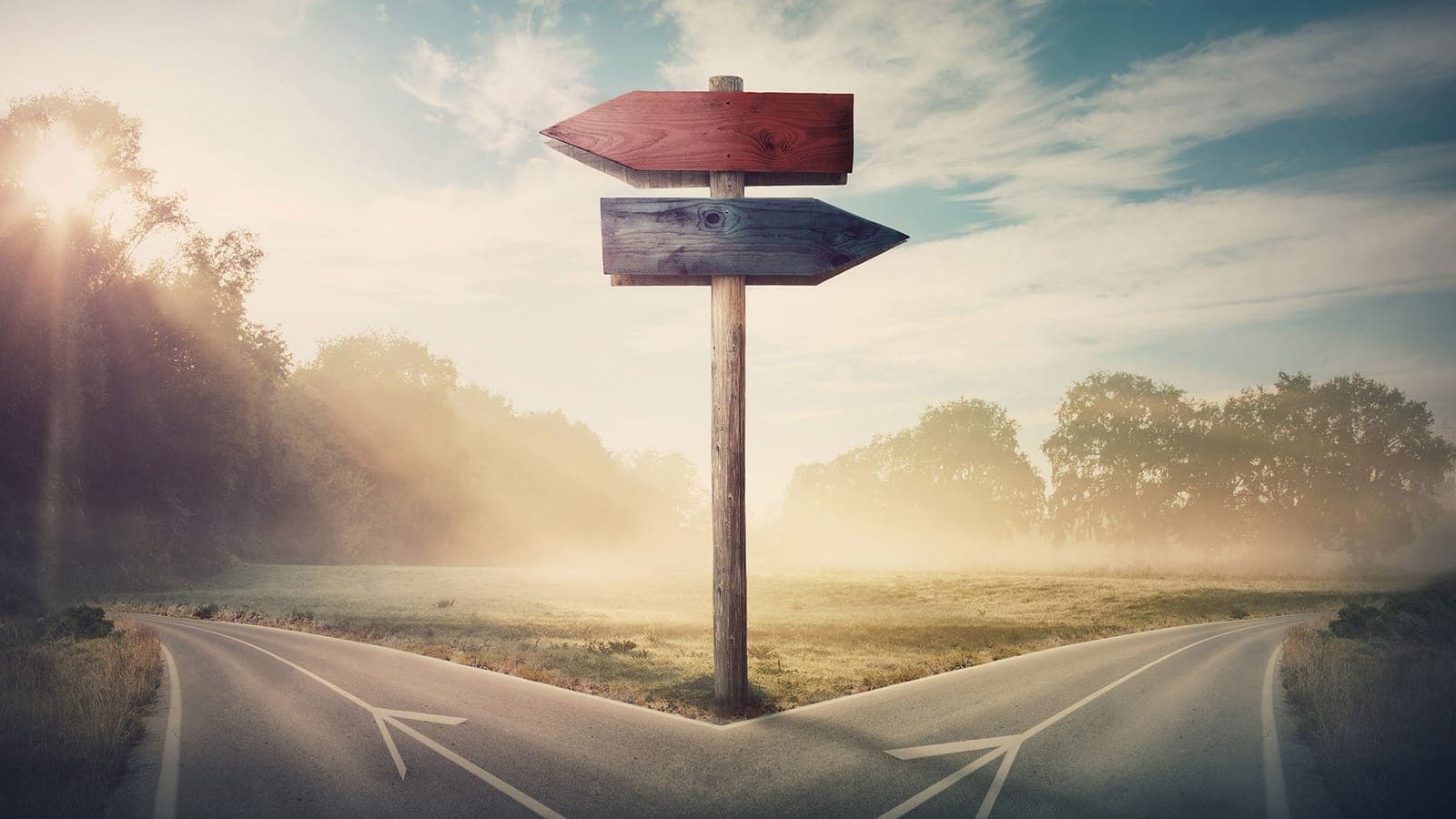 A road splitting in two directions, representing in-house versus outsourced IT