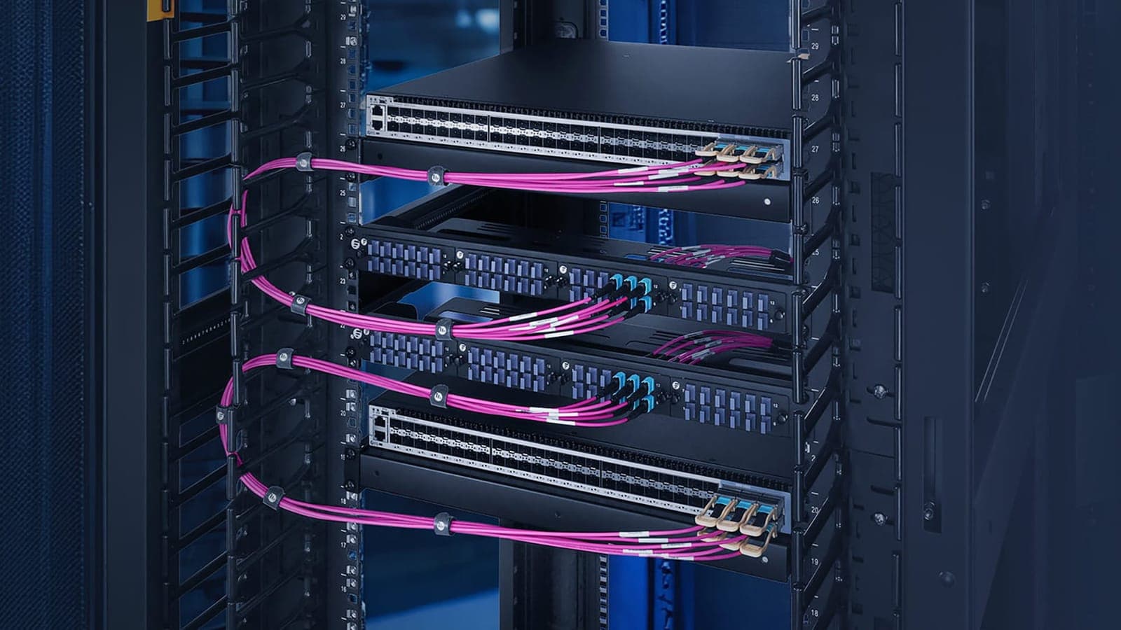 Neatly organised network switches and hardware in a server rack