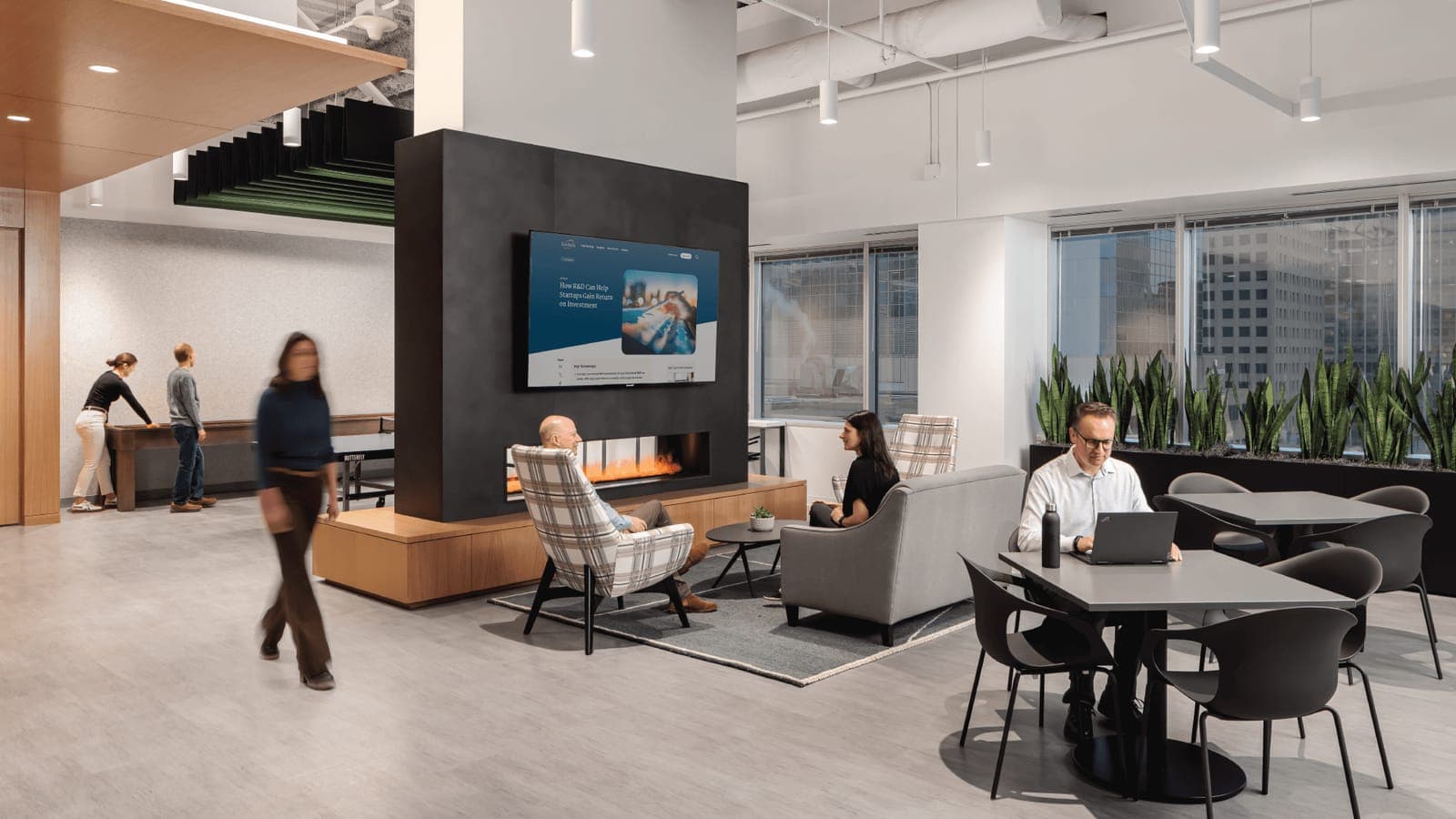 Employees moving through a busy, connected office workspace